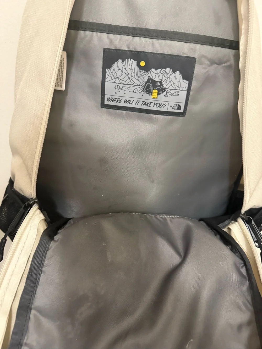 The North Face Two-Tone Beige and Black Backpack with Bungee Front